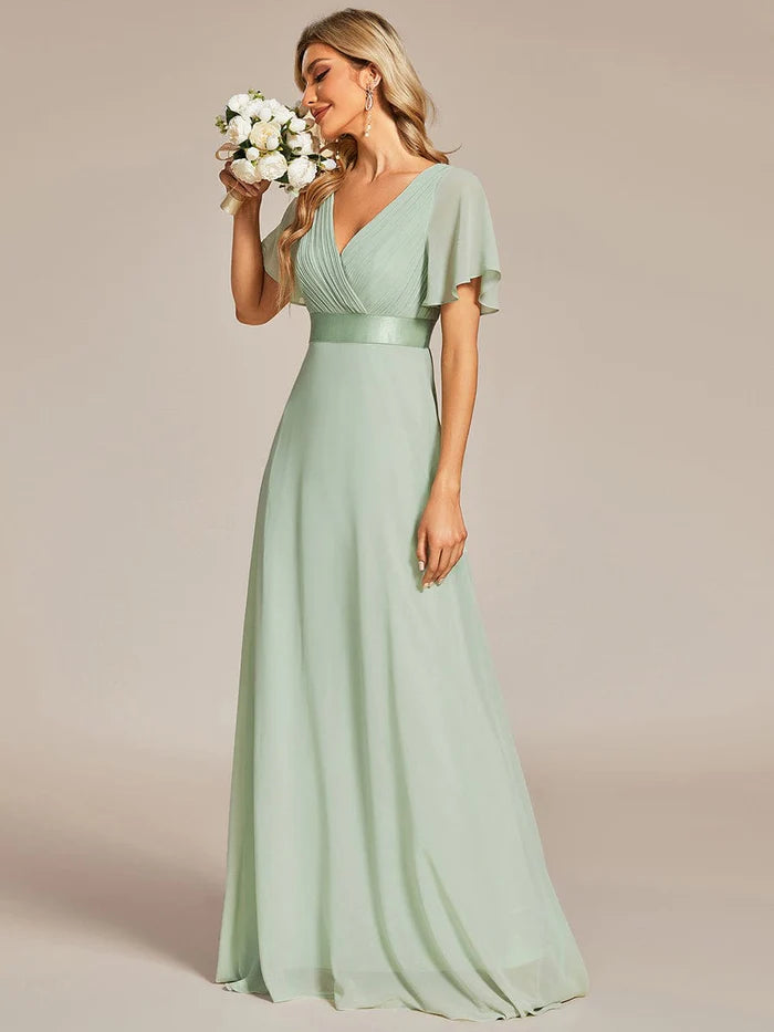 Wholesa Long Chiffon Empire Waist Bridesmaid Dress with Short Flutter Sleeves